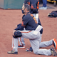 San Francisco Giants manager Gabe Kapler takes a knee Sunday.